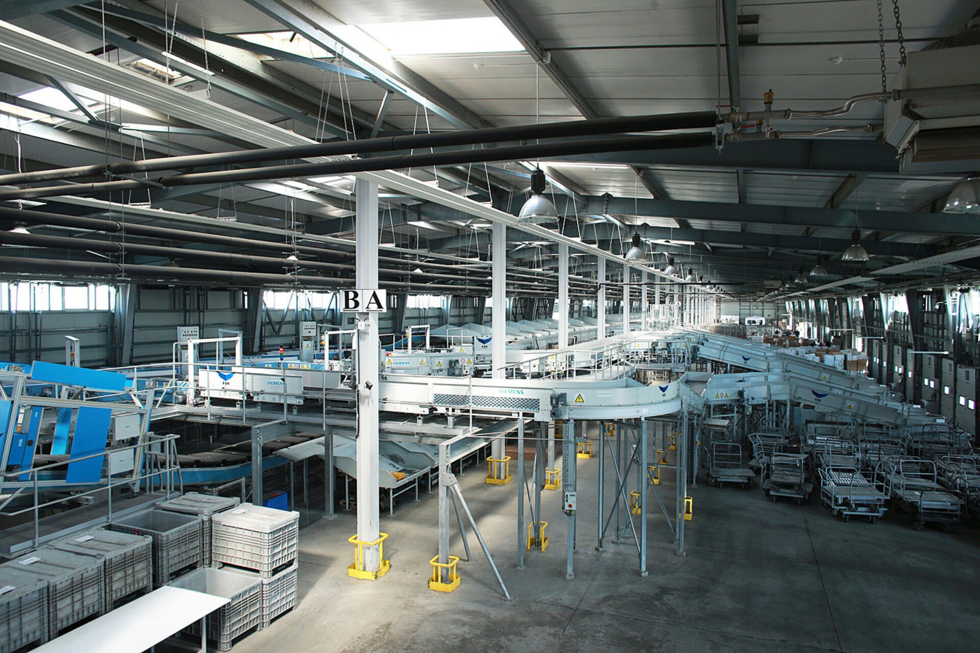 Interior of the mail sorting hall at FAN Courier Stefanesti with a conveyor system, PPAE project