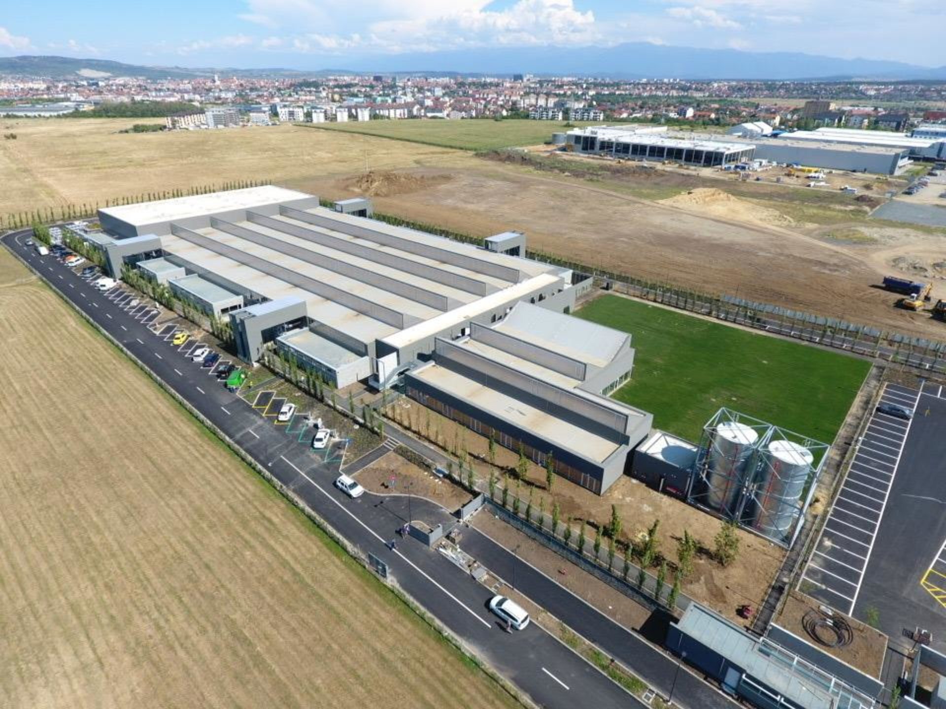Aerial view of the Prada Sibiu leather factory with a roof of multiple north-facing skylights, PPAE technical design