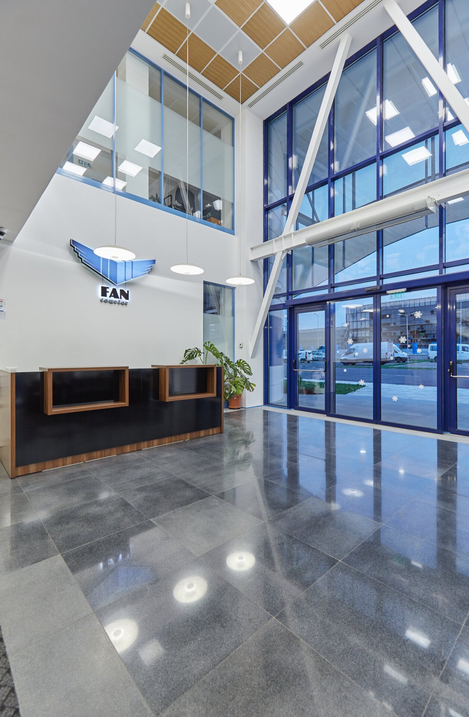 Ground-floor blue accent detail of the office building of the FAN Courier Brașov hub, project PPAE